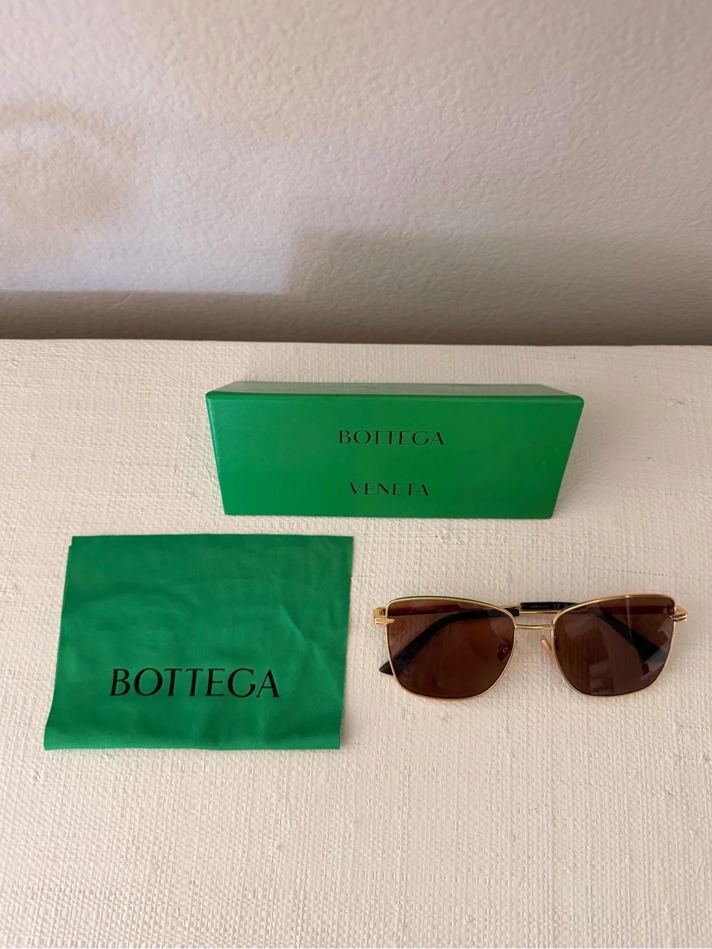 Bottega Veneta Gold Frame Sunglasses with Brown Lenses